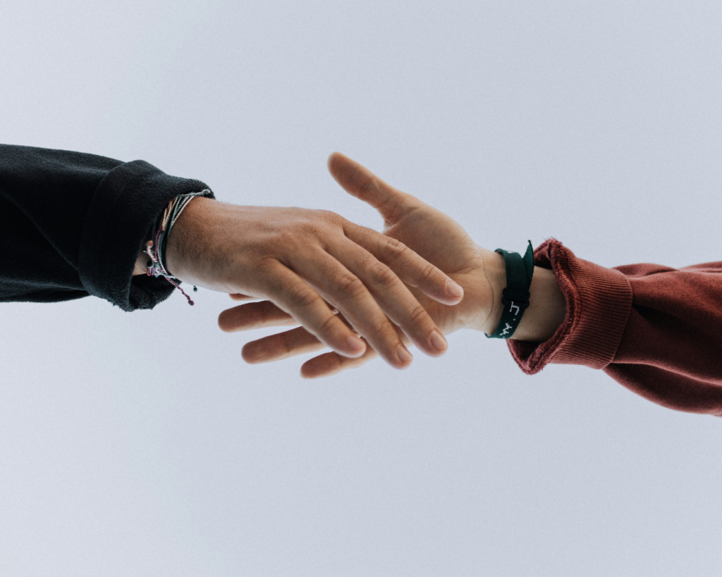 two people holding hands